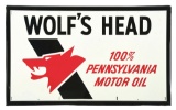 WOLF'S HEAD MOTOR OIL EMBOSSED TIN SIGN W/ SELF FRAMED EDGE.