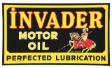 RARE & OUTSTANDING NEW OLD STOCK INVADER MOTOR OIL EMBOSSED TIN SIGN W/ ORIGINAL WOOD BACKING.