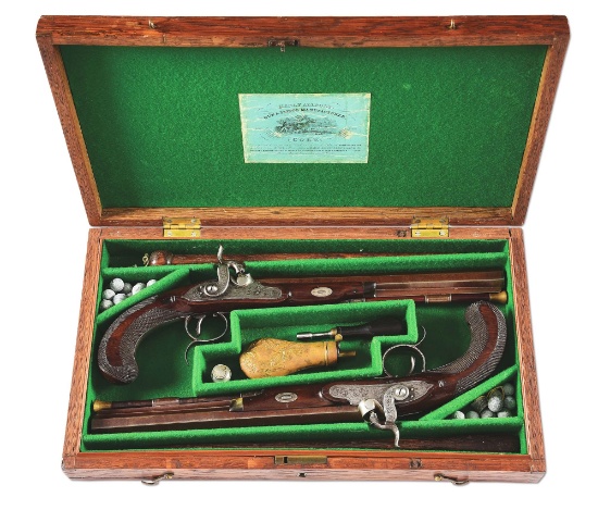 (A) A RARE PAIR OF IRISH DUELLING PISTOLS SIGNED BY BOWLS, CASED.