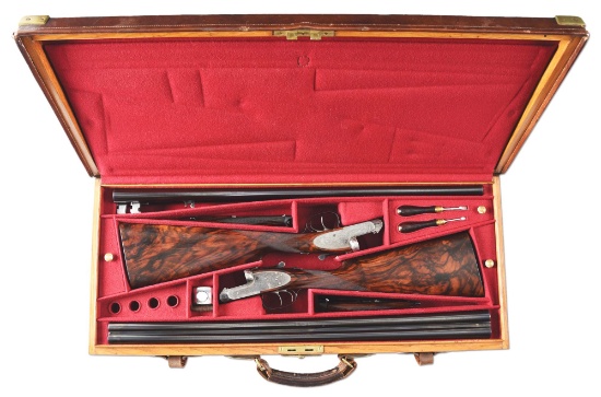 (C) CASED PAIR OF PURDEY SIDE BY SIDE SIDELOCK SHOTGUNS.