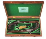 (A) A RARE PAIR OF IRISH DUELLING PISTOLS SIGNED BY BOWLS, CASED.