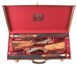 (M) CASED PAIR OF ASPREY 20 GAUGE OVER UNDER SHOTGUNS.