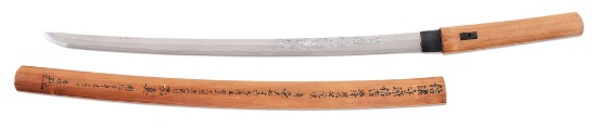 A SIGNED SHINTO WAKIZASHI WITH DRAGON HORIMONO IN SHIRASAYA MOUNTS.