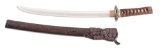SIGNED KANEMOTO KOTO WAKIZASHI IN ELABORATE MOUNTS AND PINE RESIN SAYA.