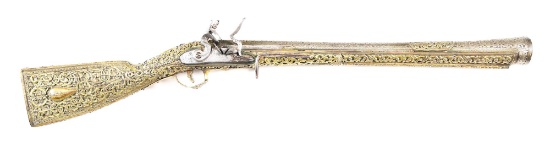 (A) A VERY SHOWY OTTOMAN BLUNDERBUSS WITH GILDED SILVER STOCK, OF THE KIND GIVEN TO MIDDLE EASTERN S