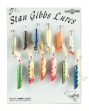 LOT OF 12: STAN GIBBS LURES ON DISPLAY BOARD.