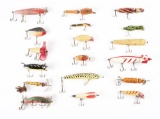 LARGE LOT OF APPROXIMATELY 20 HAND-CARVED FOLK ART TYPE FISHING LURES.