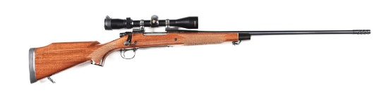 (M) REMINGTON MODEL 700 DELUXE ENHANCED RECIEVER BOLT ACTION RIFLE WITH SCOPE.