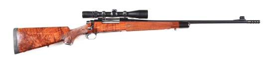 (M) REMINGTON MODEL 700 CUSTOM DELUXE BOLT ACTION RIFLE WITH SCOPE.
