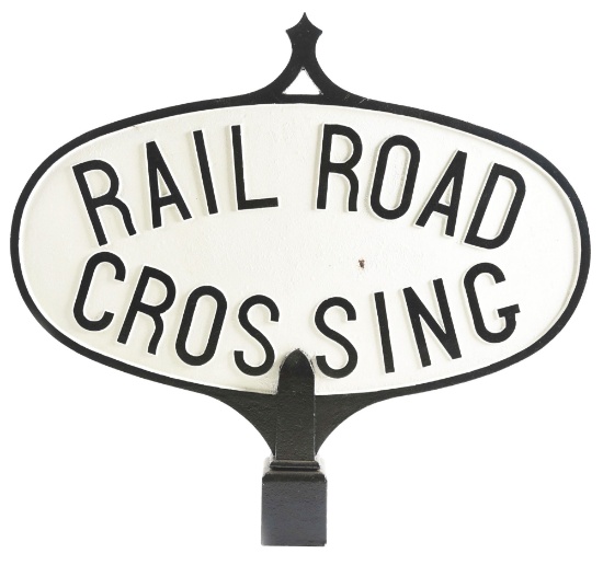 TWO-SIDED OVAL "RAILROAD CROSSING" CAST IRON SIGN.