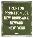 HAND PAINTED MASONITE TRAIN ANNOUNCEMENT SIGN W/ METAL BANDED EDGE.