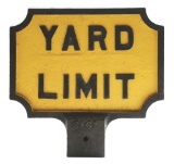TWO-SIDED CAST IRON POLE-MOUNTED YARD LIMIT SIGN.