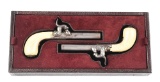 (A) PAIR OF BELGIAN MUFF PERCUSSION PISTOLS.