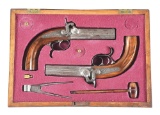 (A) PAIR OF HIGHLY UNUSUAL GERMAN OVER/UNDER SASH PISTOLS BY RAITHEL, WITH A RIFLED BARREL AND A SMO