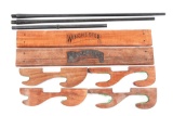 LOT OF 5: WINCHESTER MODEL 42 BARRELS AND MAGAZINE TUBE WITH WOODEN GUN RACKS.