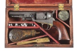 (A) CASED GUSTAVE YOUNG FACTORY ENGRAVED COLT 1849 POCKET PERCUSSION REVOLVER.