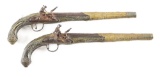 (A) PAIR OF MIDDLE EASTERN DECORATED FLINTLOCK PISTOLS.