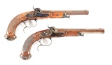 (A) CASED PAIR OF PERCUSSION TARGET PISTOLS WITH CANON A RUBANS BARRELS, PROBABLY FRENCH.