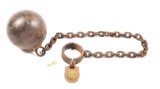 ANTIQUE BALL AND CHAIN WITH BRASS PADLOCK.