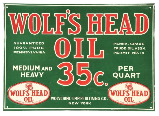 RARE N.O.S. WOLF'S HEAD MOTOR OIL EMBOSSED TIN SIGN.