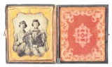 CIVIL WAR TINTYPE OF SOLDIERS WITH REVOLVERS AND CAVALRY SABERS.