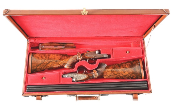 (M) PAIR OF IVO FABBRI SIDELOCK SIDE BY SIDE 12 GAUGE SHOTGUNS WITH ENGRAVED SCENES BY TOMASONI.