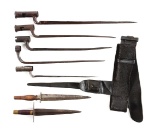 LOT OF 7: REVOLUTIONARY WAR SOCKET AND PLUG BAYONETS, ALONG WITH SCABBARD AND BELT.
