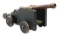 CAST IRON CANNON ON NAVAL CARRIAGE.