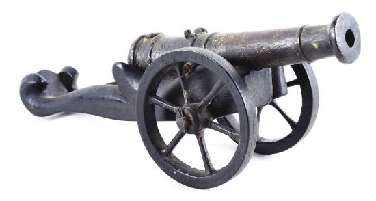 SMALL CAST BRONZE CANNON MODEL ON WOOD CARRIAGE.