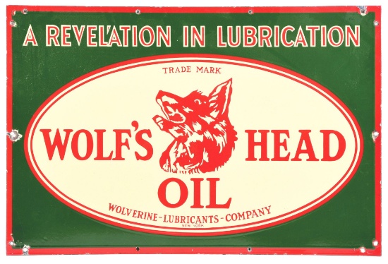 RARE WOLF'S HEAD OIL "A REVELATION IN LUBRICATION" PORCELAIN SERVICE STATION SIGN.