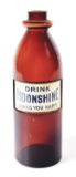 DRINK MOONSHINE AMBER BOTTLE.