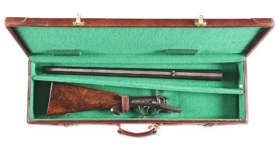 (C) RIGBY HAMMER FIRED DOUBLE RIFLE IN .303 BRITISH, CASED.