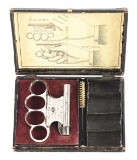 (A) LE CENTENAIRE KNUCKLE GUN WITH RARE ORIGINAL PICTURE BOX.