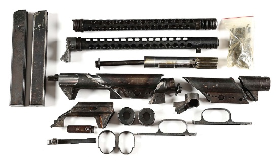 NICE GROUPING OF ITALIAN BERETTA 38A MACHINE GUN PARTS INCLUDING BARRELS SHROUDS AND MAGAZINES.