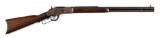 (A) WINCHESTER MODEL 1873 LEVER ACTION RIFLE WITH DESIRABLE SEVEN LEAF EXPRESS SIGHT (1891).