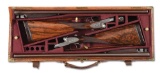 (A) CASED PAIR OF WILLIAM POWELL & SON SIDELOCK EJECTOR SIDE BY SIDE 12 GAUGE SHOTGUNS.
