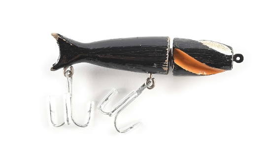 VAUGHN’S LURE IN BLACK WITH GREEN, WHITE & ORANGE FLUTES