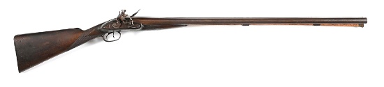 (A) MASSIVE COMPOSITE SIDE BY SIDE FLINTLOCK SHOTGUN.