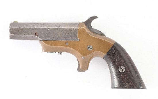 (A) BROWN / MERRIMACK MANUFACTURING "SOUTHERNER" BRASS FRAMED SINGLE SHOT DERRINGER.