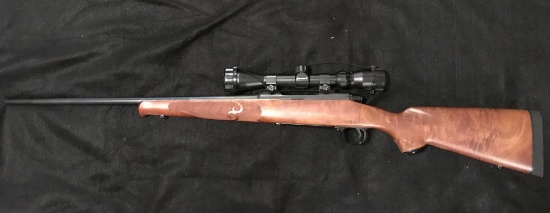 Winchester Model 70 Featherweight Bolt Action in a .30-.06 caliber with Barska 3x9 Scope