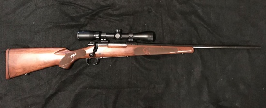 Winchester Model 70 XTR Featherweight With Bolt Action in a .257 Roberts with Bushnell 3x9 Scope