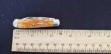 W.R. Case & Sons Cutlery Co., Item no. 09803, 154 62154W SS. Tiny Trapper BN PS, Sunset Orange