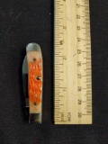 W.R. Case & sons Cutlery CO., Hem No. 09794, 154, 6215W SS, Tiny Trapper, BN RG , Salmon 4D