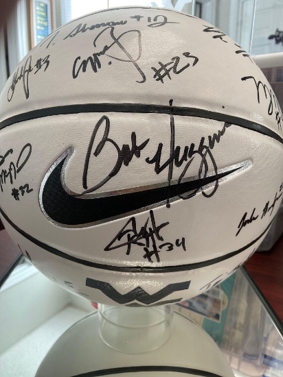 West Virginia basketball signed by Coach Bob Huggins and 13 basketball players. Nike basketball and