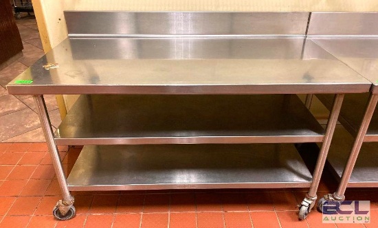 DESCRIPTION 60" X 32" CUSTOM STAINLESS STEEL WORK TABLE W/ 6" BACKSPLASH ON CASTERS SIZE 60" X 32"