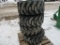 Four 12-16.5 skid loader tires