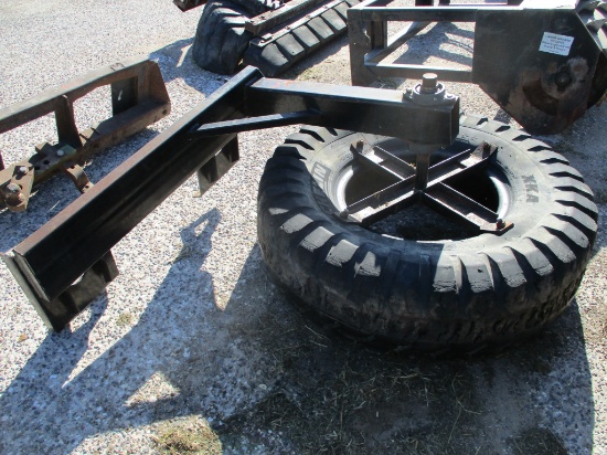 Skid loader rubber tire feed pusher