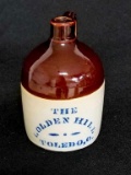 1 PINT BROWN TOP MINI JUG W/THE GOLDEN HILL, TOLEDO, OH - EXCELLENT