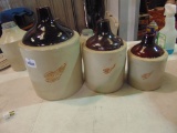 SET OF 3 BROWN TOP WING JUGS: 1 GALLON; 1/2 GALLON; 1 QRT - 1 GALLON HAS BASE CHIP