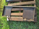 Universal skid loader mnt plate